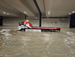 A truck stuck in floodwater in an underpass in Dubai