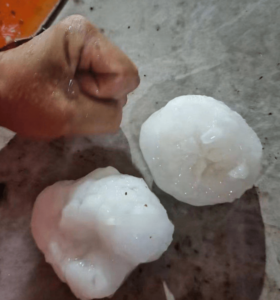A comparison of a human fist with hail that fell in Guangzhou on Saturday, 27th April