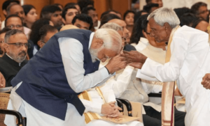 PM Modi bows before Padma Shri Awardee Bhagwat Pradhan
