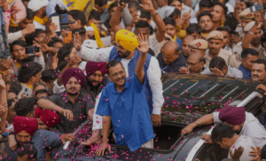 Arvind Kejriwal in an campaign roadshow in New Delhi, on Saturday. PTI