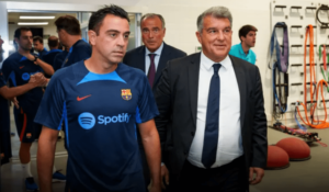 Barca head coach Xavi Hernandez (L) and club president Joan Laporta (R). SK